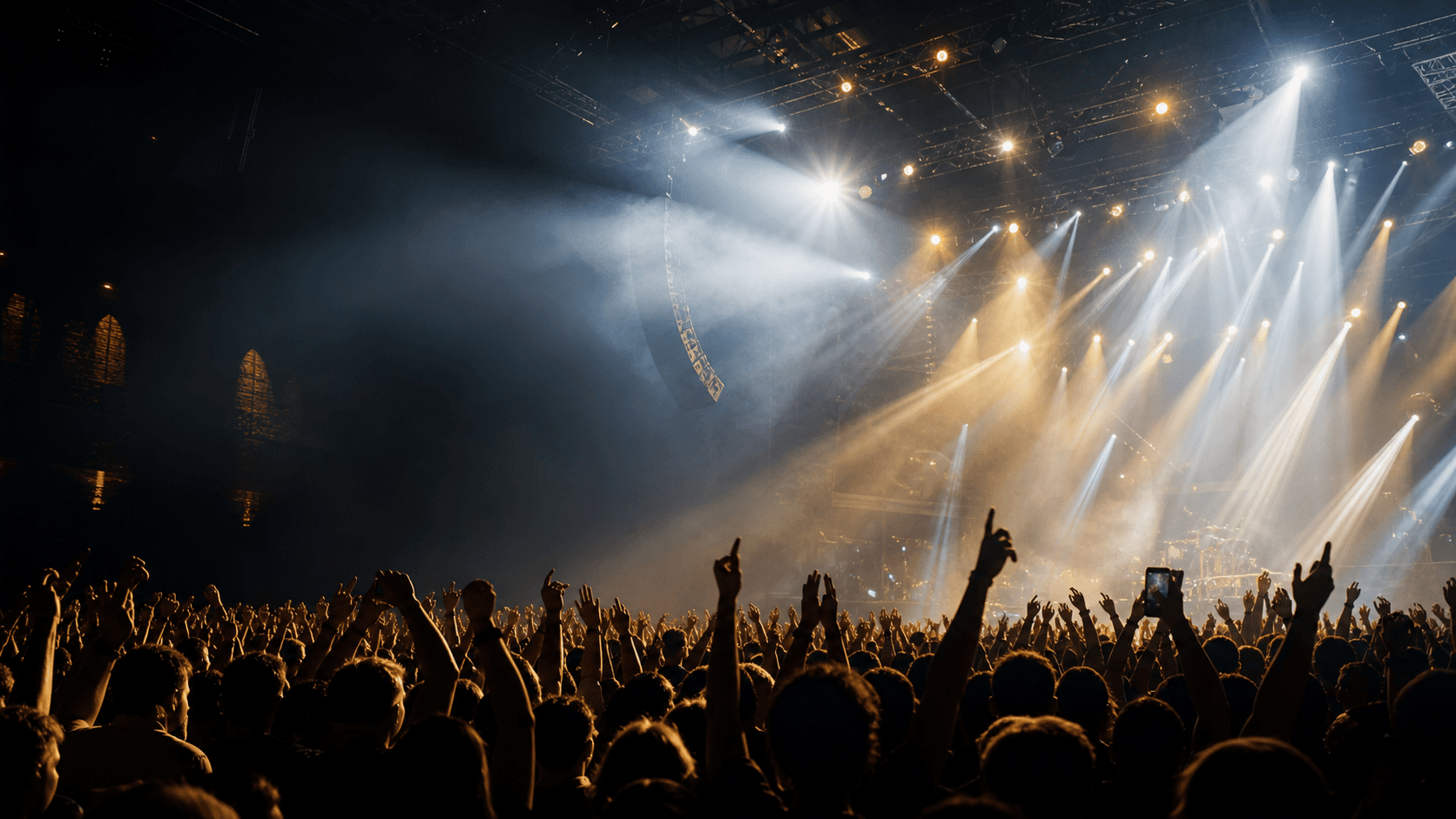Packed concert crowd under bright venue lights for promoter discovery
